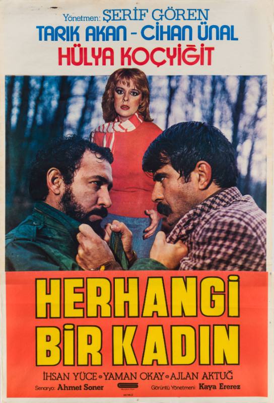 A poster of two men gripping each other's shirt collars in front of a woman looking at the viewer.