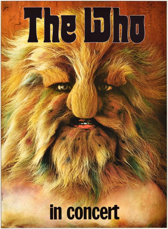 A poster of a furry brown monster's face.