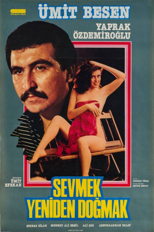 A poster of a man's face next to an image of a woman covering herself with a pink towel.