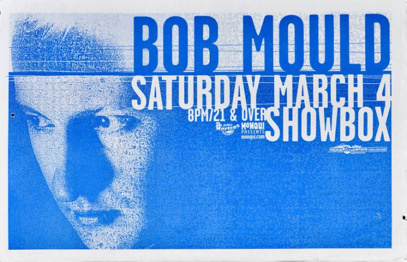 A poster of a white man's face looking to the left printed on a blue background