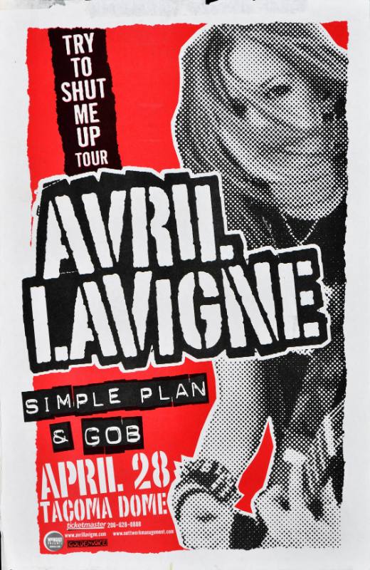 A poster of a white woman with hair blowing over her face printed on a red, white, and black background