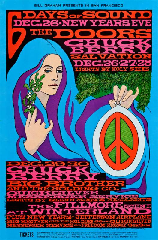 A psychedelic poster of a woman in a striped flowing cloak holding a peace sign