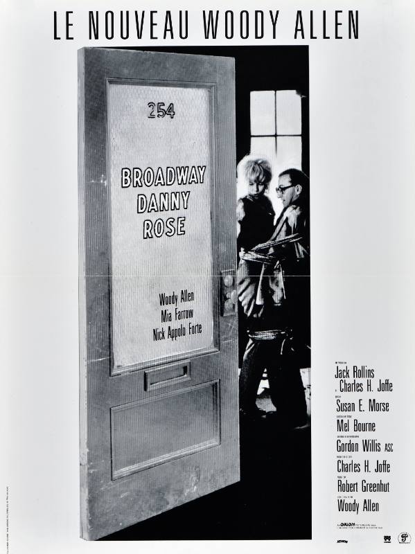 A poster of a slightly open door with writing on it; inside, there are two people sitting by a window