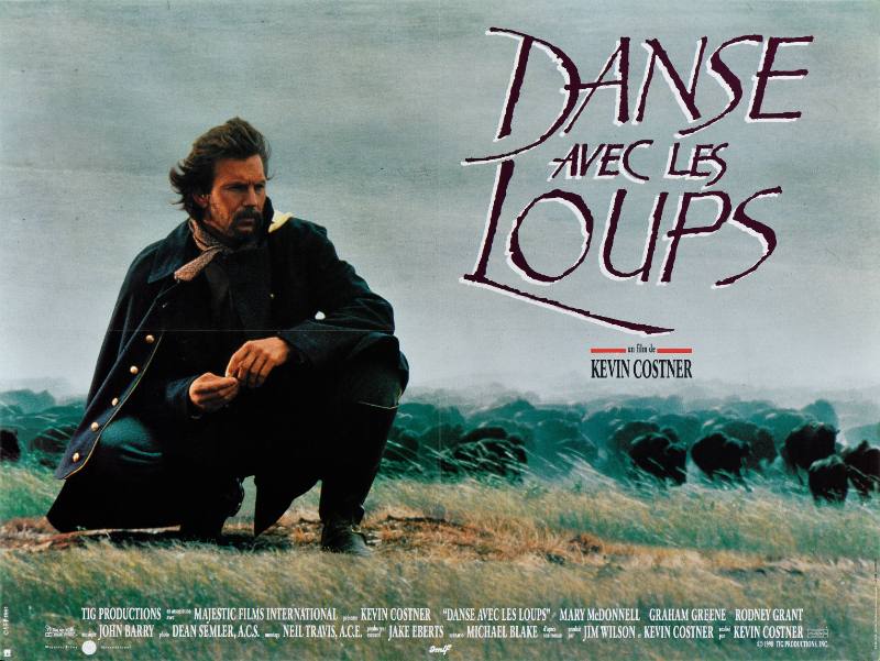 A poster of a white man kneeling with a serious expression in tall grass