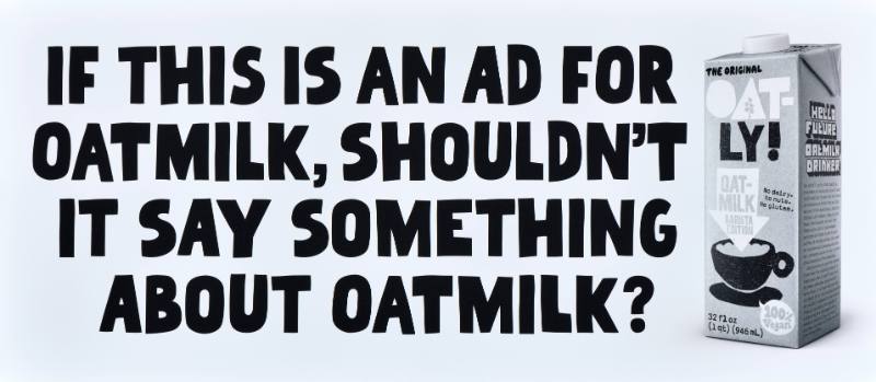 A poster with black text on a white background next to a carton of oatmilk