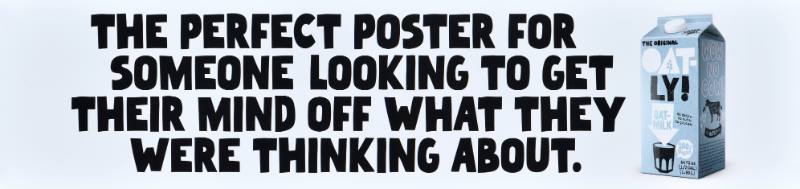 A poster with black text on a white background next to a carton of oatmilk