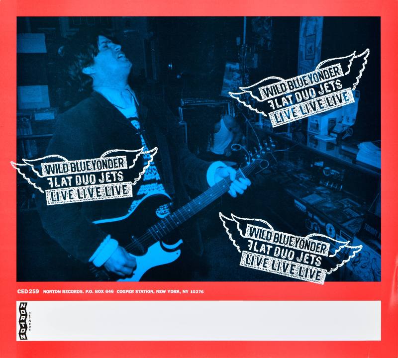 A poster of a band of white man playing guitar