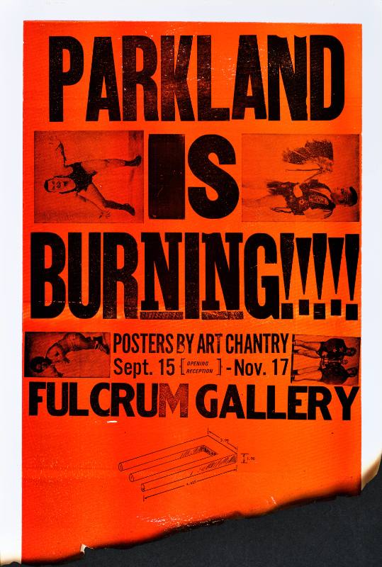 A poster of wrestlers printed on a red background with a burnt edge