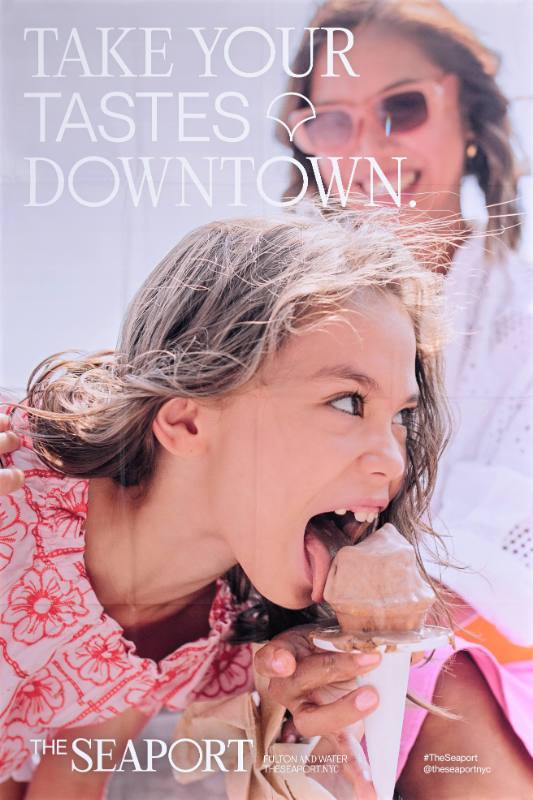 A poster of a white child licking an ice cream cone