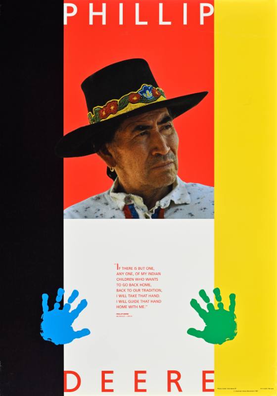 A poster of a Native American man above two colorful handprints