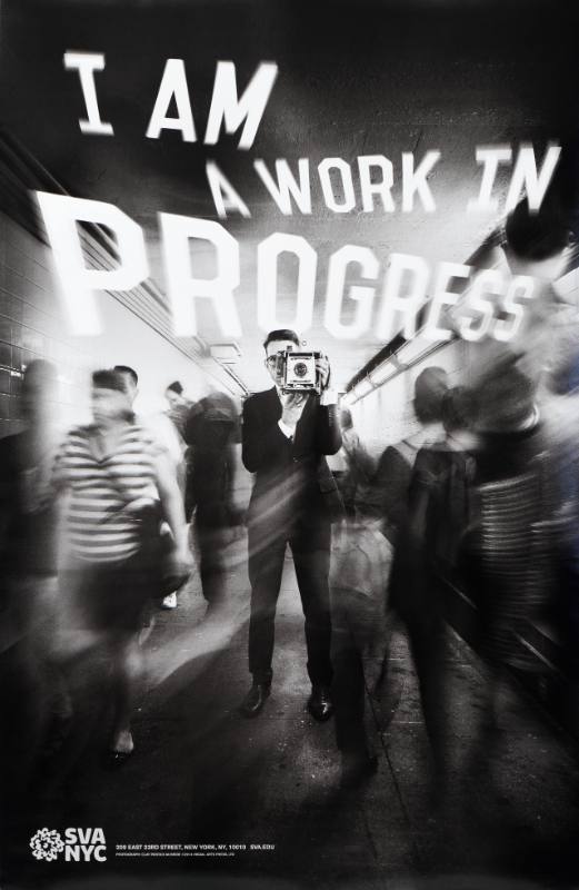 A poster of a man holding an old fashioned camera as blurry people walk by him in the subway
