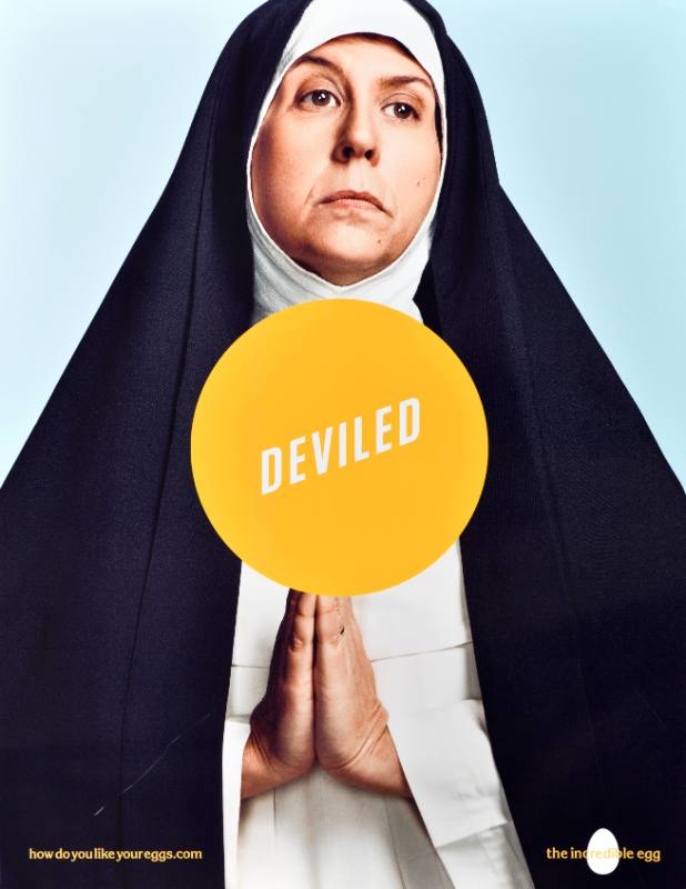 A poster of a nun with a yellow circle at her middle