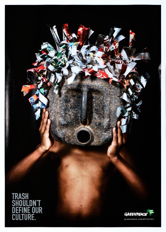 A poster of a Black figure holding a mask made out of trash