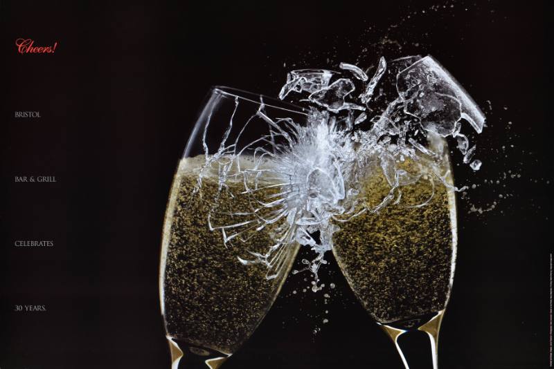 A poster of two glasses shattering against one another