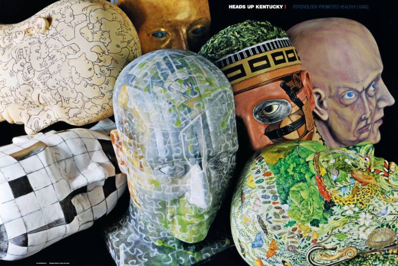 A poster of a stack of colorful painted heads