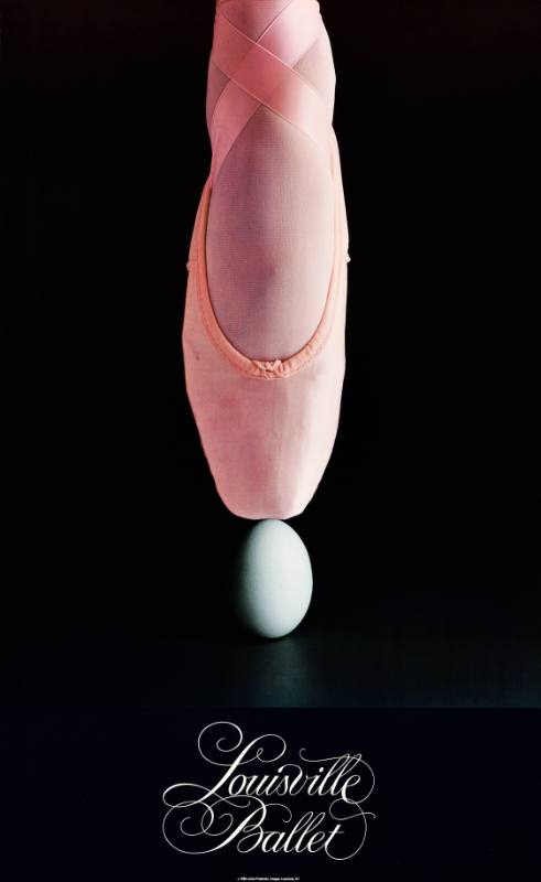 A poster of a ballet shoe balancing on top of an egg