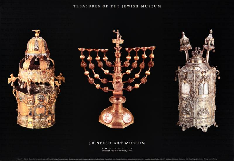 A poster of three ornate golden objects on a black background