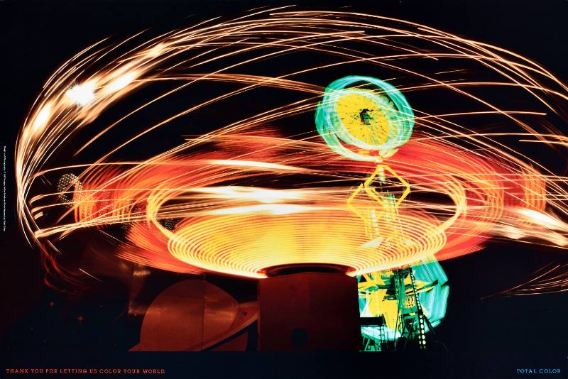 A poster of colorful blurry neon lights on a black background