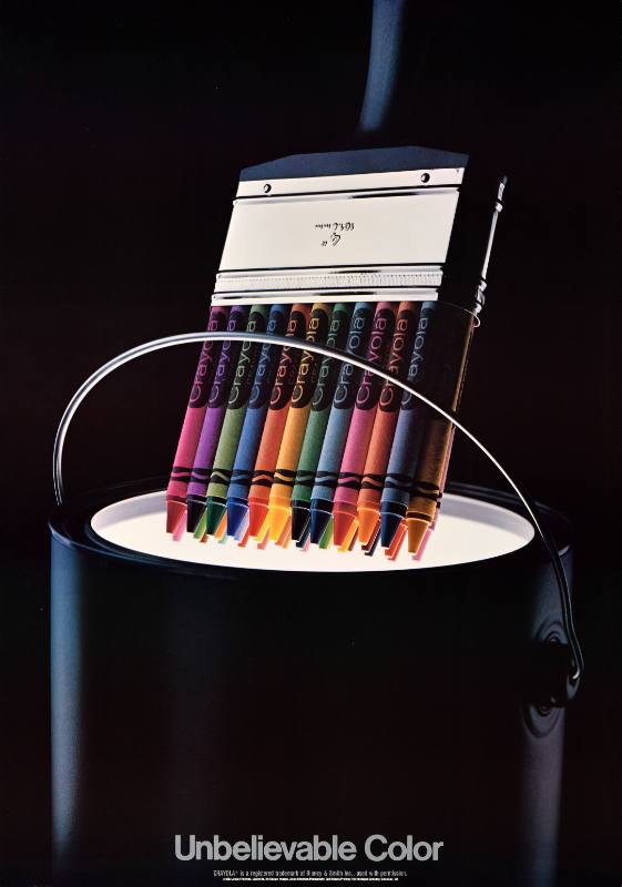 A poster of a box of crayons being poured into a can of white paint