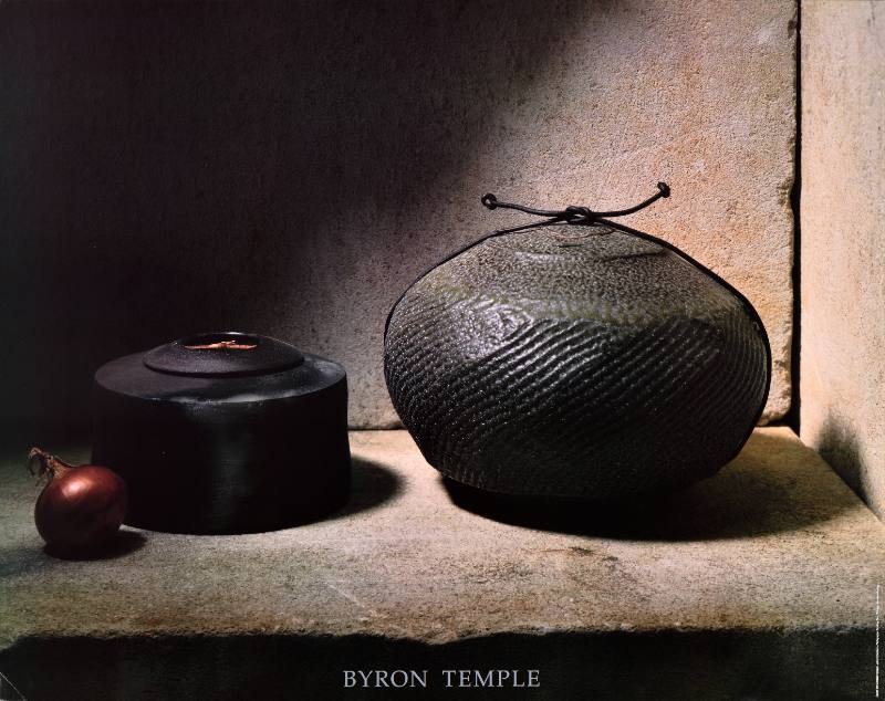 A poster of dark metal vessels on a ledge