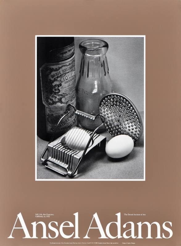 A poster of a black and white photograph of kitchen utensils chopping an egg