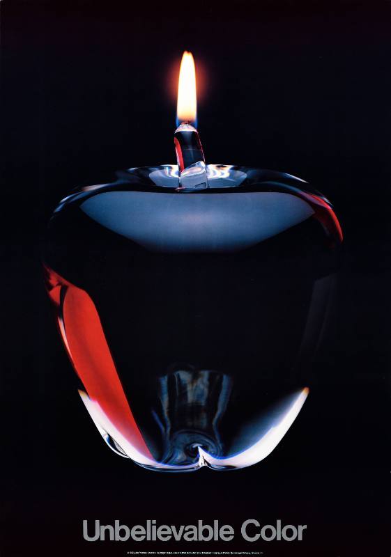 A poster of a glass apple with a flame at the top of its stem
