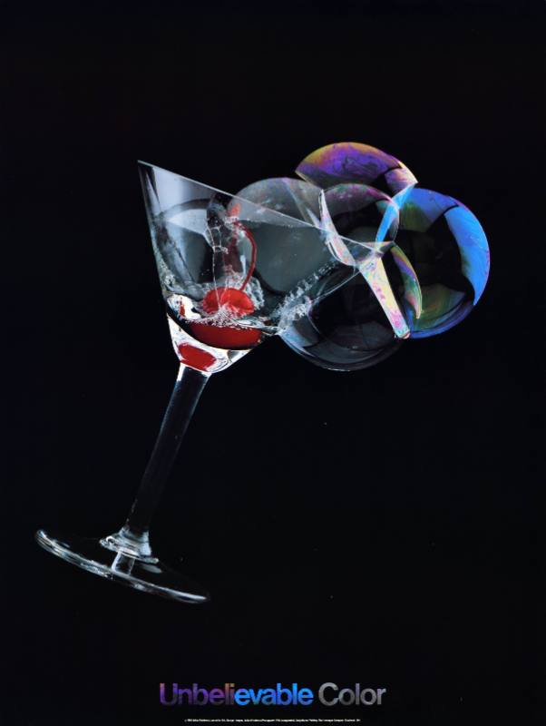 A poster of a martini glass full of colorful bubbles