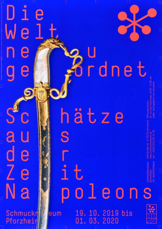 A poster of a sword on a blue background surrounded by blocky red text