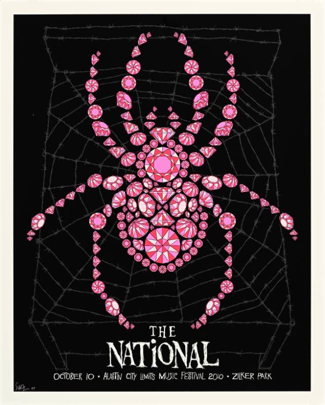 A poster of a spider made out of pink jewels