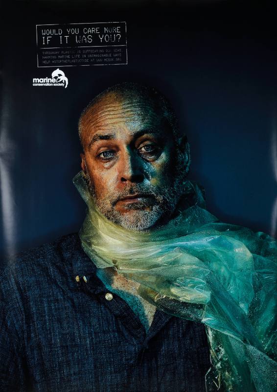 A poster of a man with a plastic bag strangling his neck