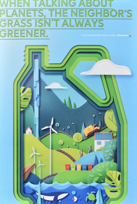 A poster of a plastic bottle made out of landscapes