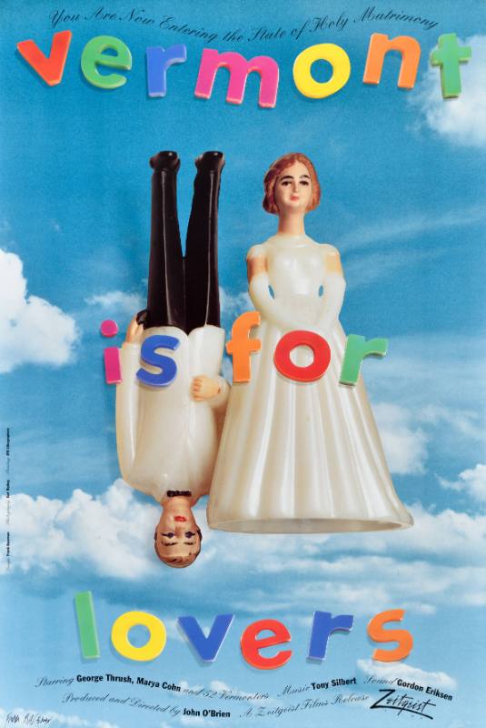 A poster of a toy bride and groom below fridge magnet letters