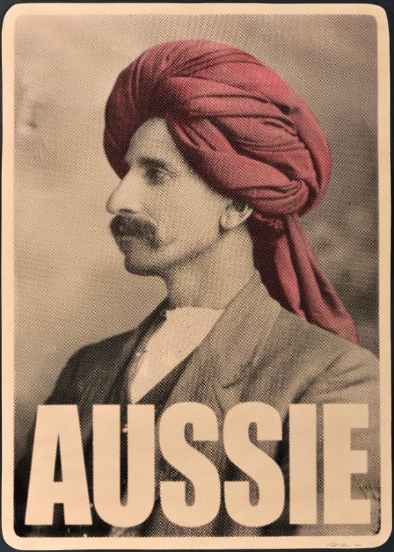 A poster of a man in a turban with bold black text below his face