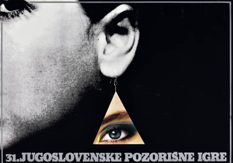 A poster of a woman with an earring made out of an eye