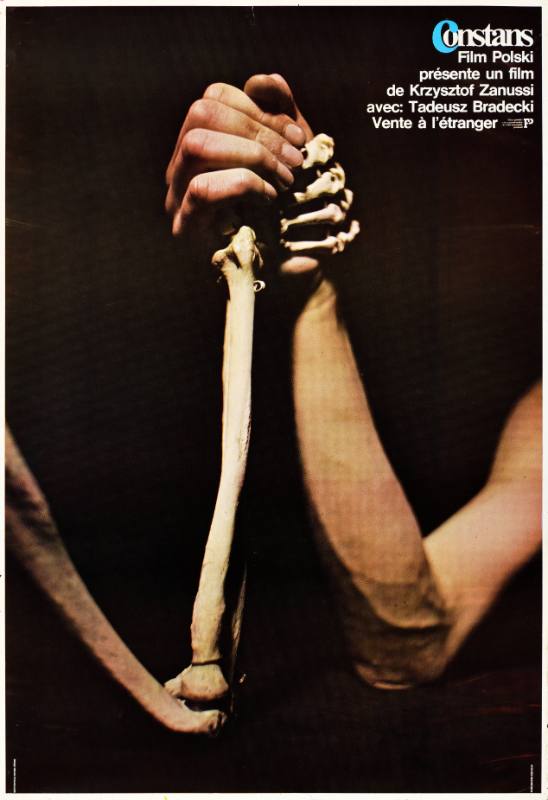 A poster of a man arm wrestling with a skeleton