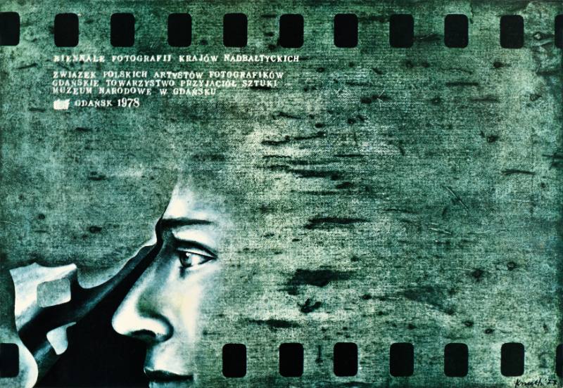 A poster of a mysterious blue figure's face on an abstract background