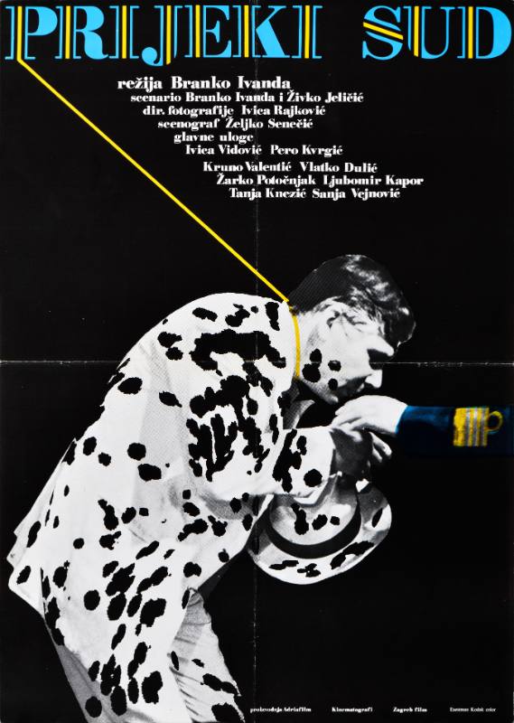 A poster of a man in a polkadot suit bending to kiss another man's arm