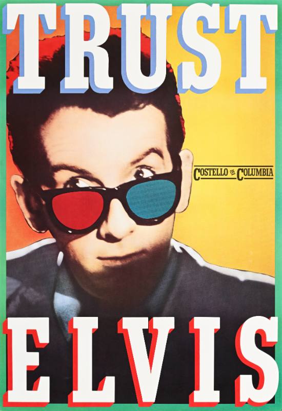 A poster of a white man with blue and red glasses below 3d text