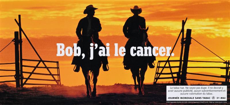 A poster of two cowboys on horseback at sunset with white text on top