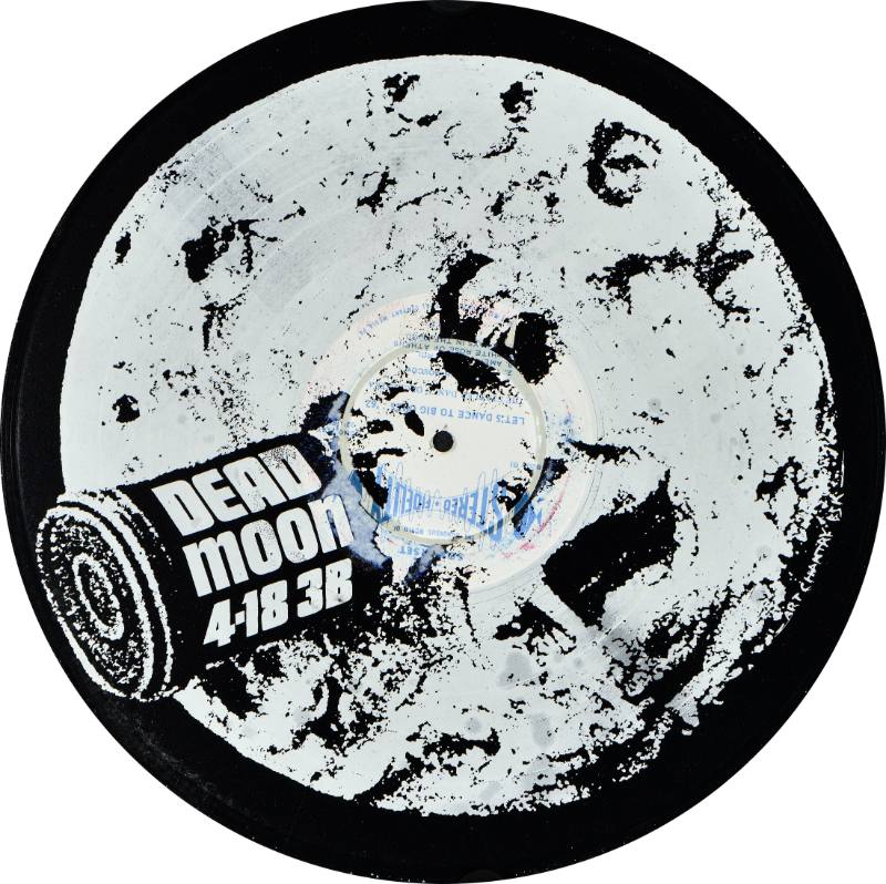 A record printed with the image of the moon with a face on it