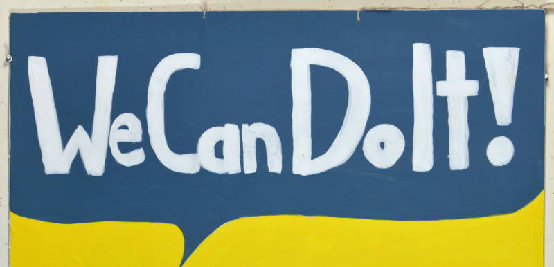 A poster with white text on a yellow and blue background