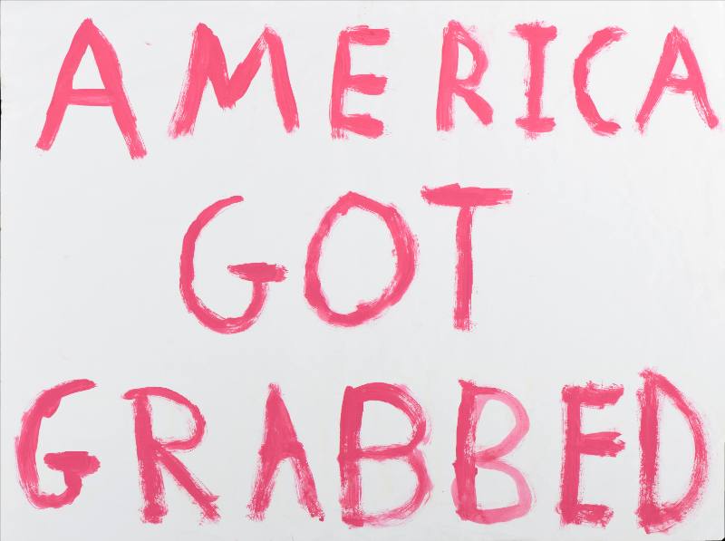 A text based poster with pink smeared text