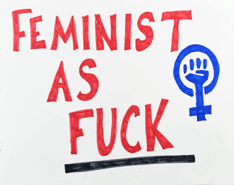A poster with red text and a blue raised fist on a white background 