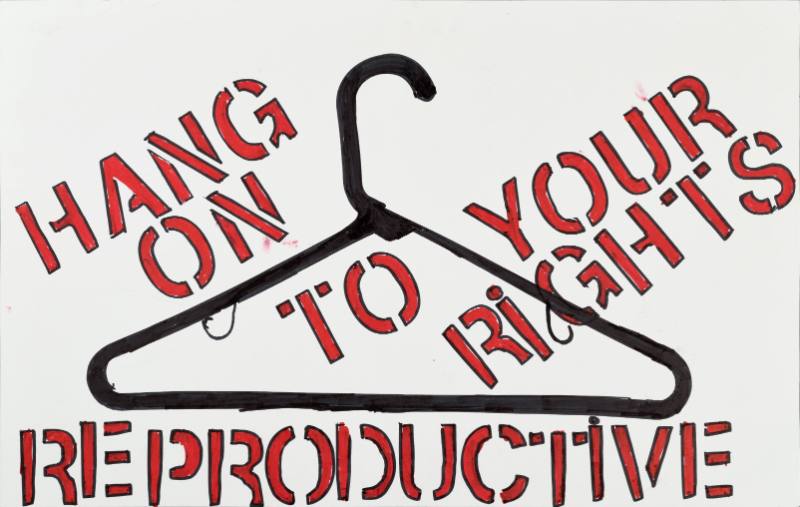 A poster of text and a metal coat hanger on a white background