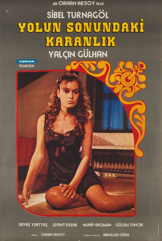 A photographic poster of a woman sitting in a black lacy nightgown in an orange decorative frame.