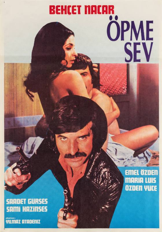 A photographic poster of a man brandishing a pair of pistols in front of a nude couple embracing in bed.