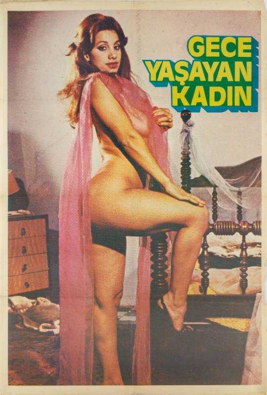 A photographic poster of a nude woman standing at the end of her bed wearing heels and a long pink scarf.