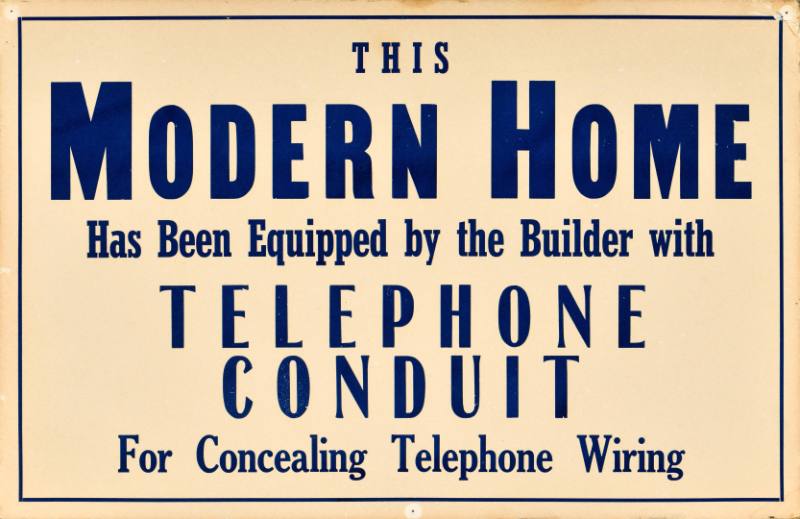 A type based poster featuring blue block print on a taupe background.