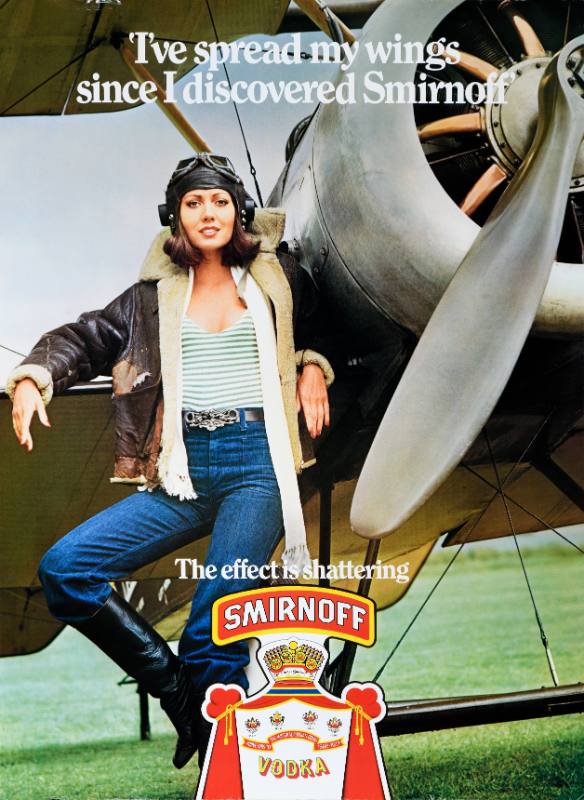 A poster of a white woman in pilot gear next to a biplane