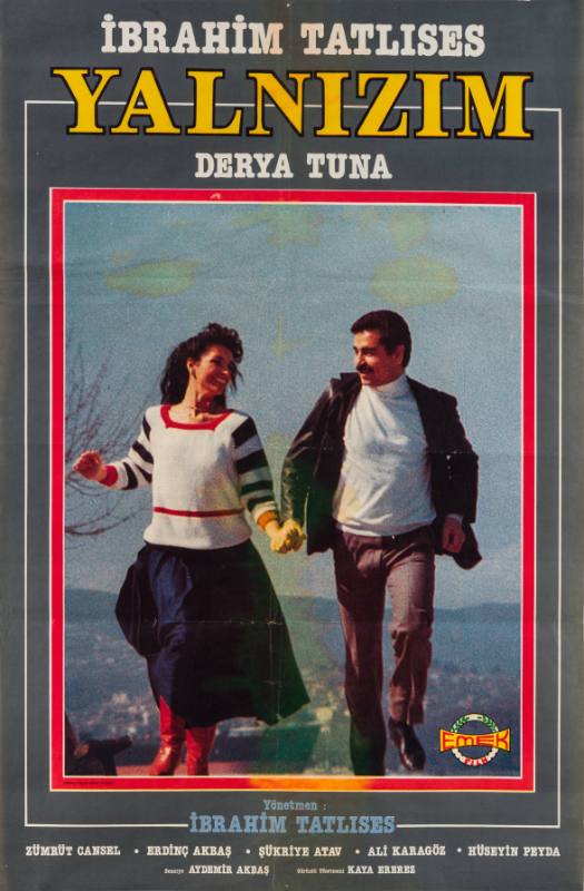 A poster of a mustachioed man and a woman in a white sweater smiling, running, and holding hands.